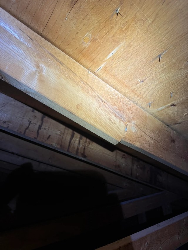 A cracked wooden beam.