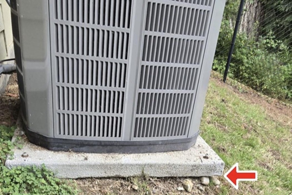 A heat pump on a pad.