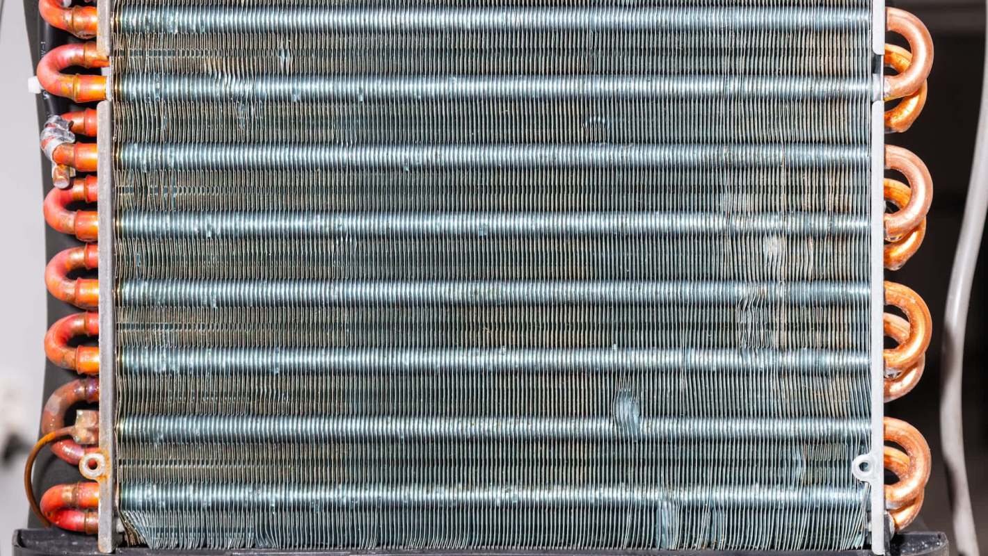 An industrial heat exchanger with copper pipes and metal fins.