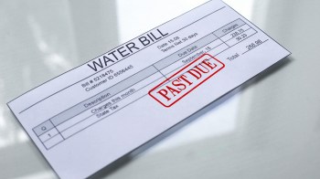 A water bill marked as "PAST DUE" with charges and due date details.