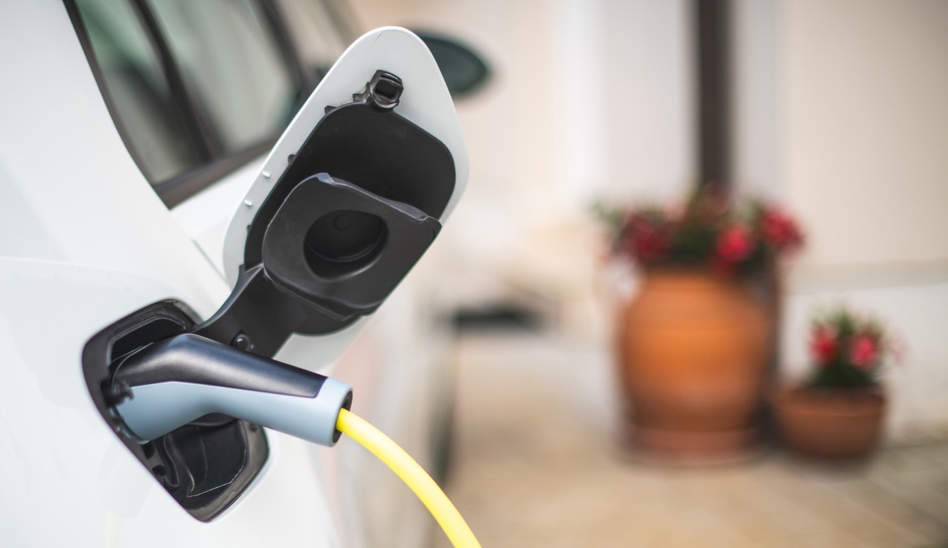 A charger plugged into an electric vehicle.