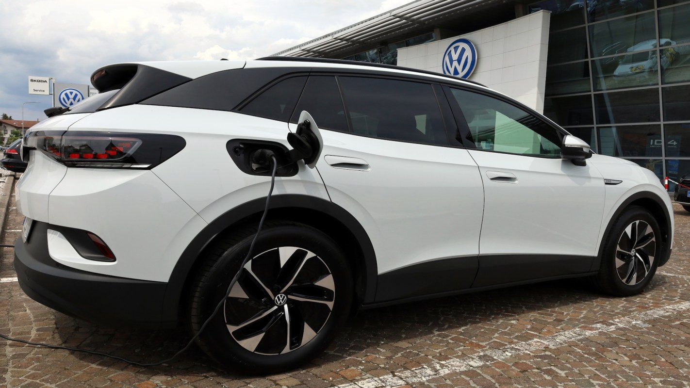 An electric vehicle is plugged in at a Volkswagen dealership.