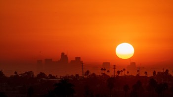 The sun in an orange sky.