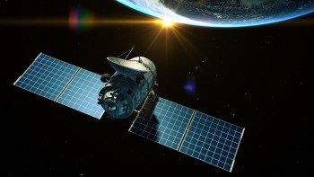 A satellite orbits Earth with solar panels extended and the sun rising in the background.
