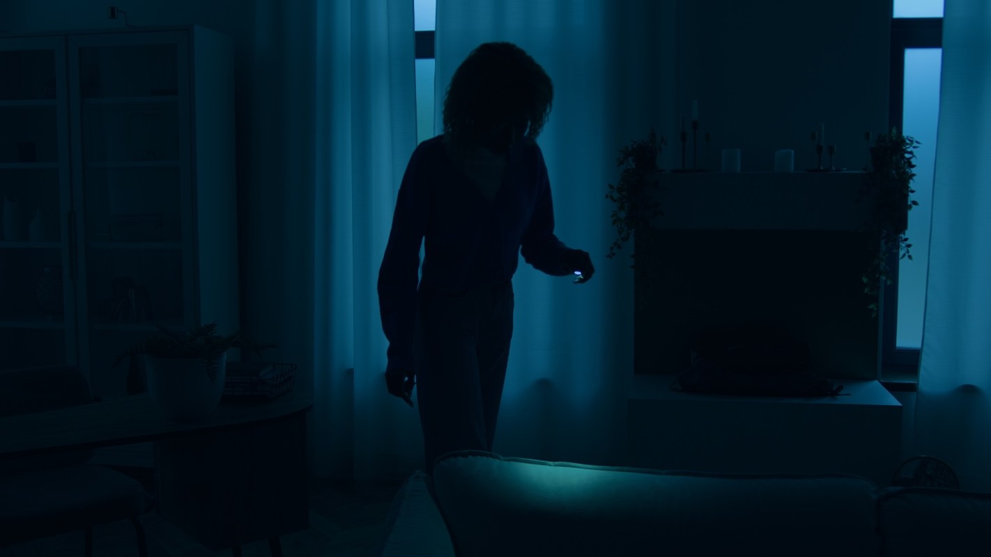 A person in a dark room.