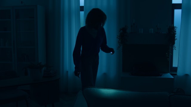 A person in a dark room.