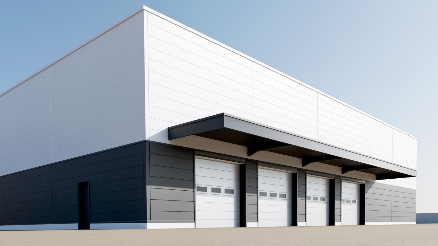 A modern industrial building with three loading docks and a sleek exterior.