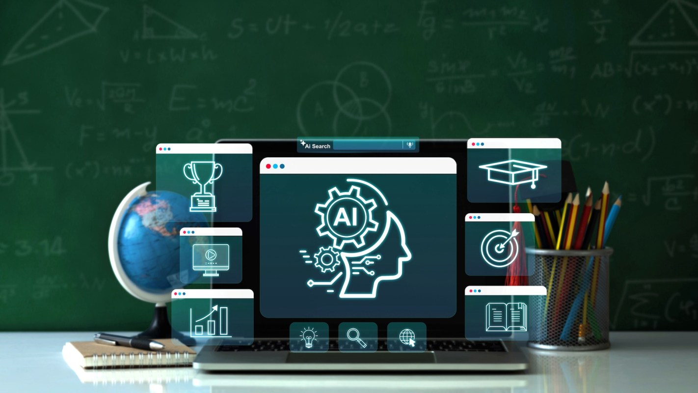 A laptop displaying AI-related icons with a globe and a pencil holder filled with colorful pencils in the background.