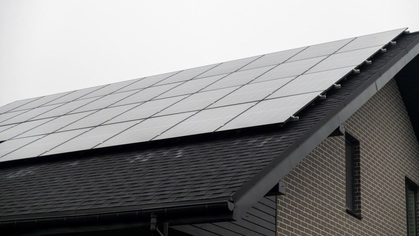 Solar panels installed on the roof of a modern house.