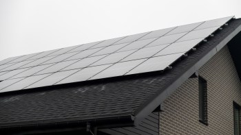 Solar panels installed on the roof of a modern house.