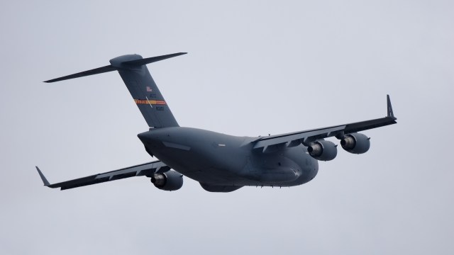 A flying U.S. military cargo plane.