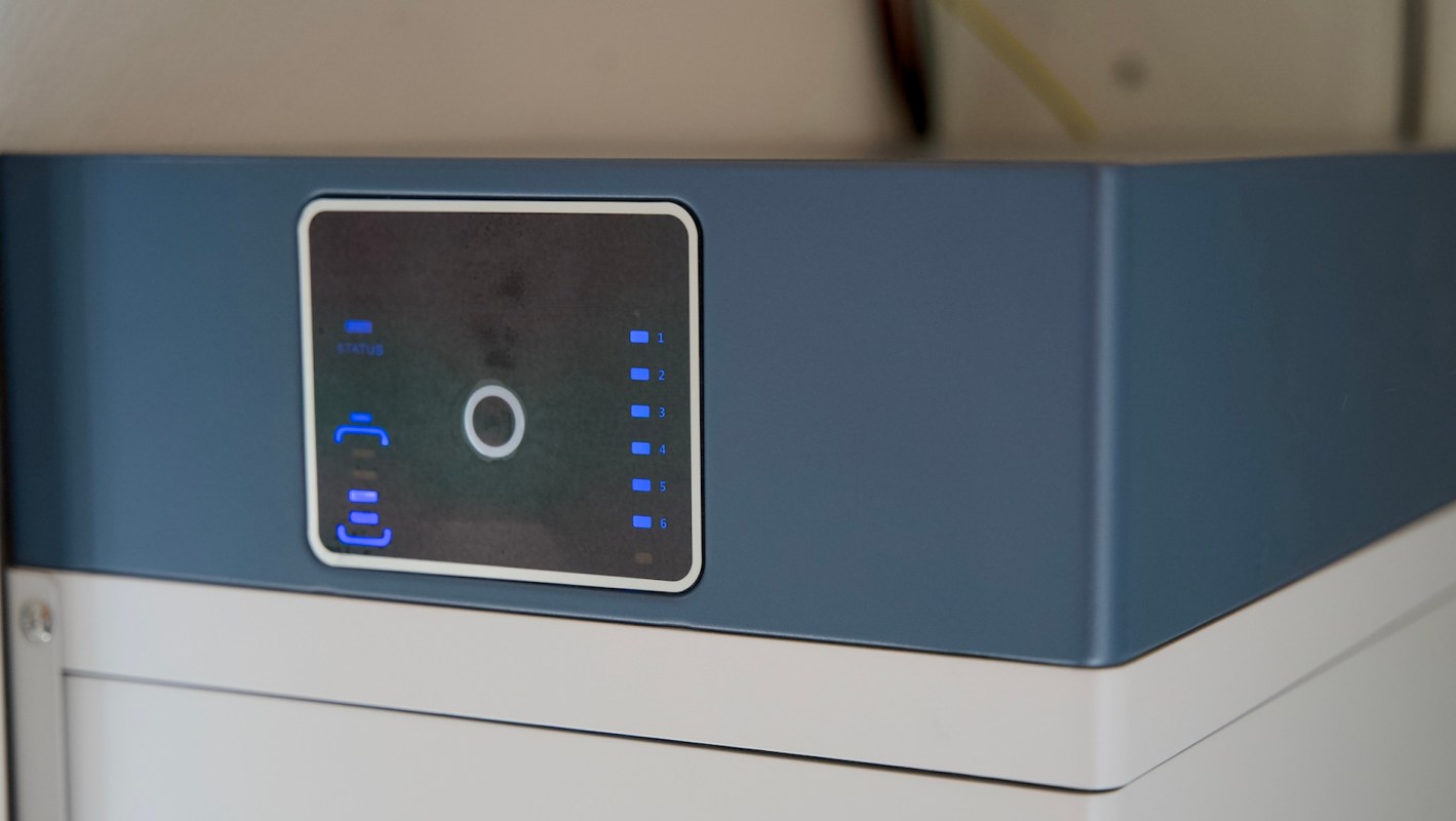 A control panel with blue LED indicators on a home battery storage device.