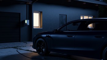 An EV charging outside a home.