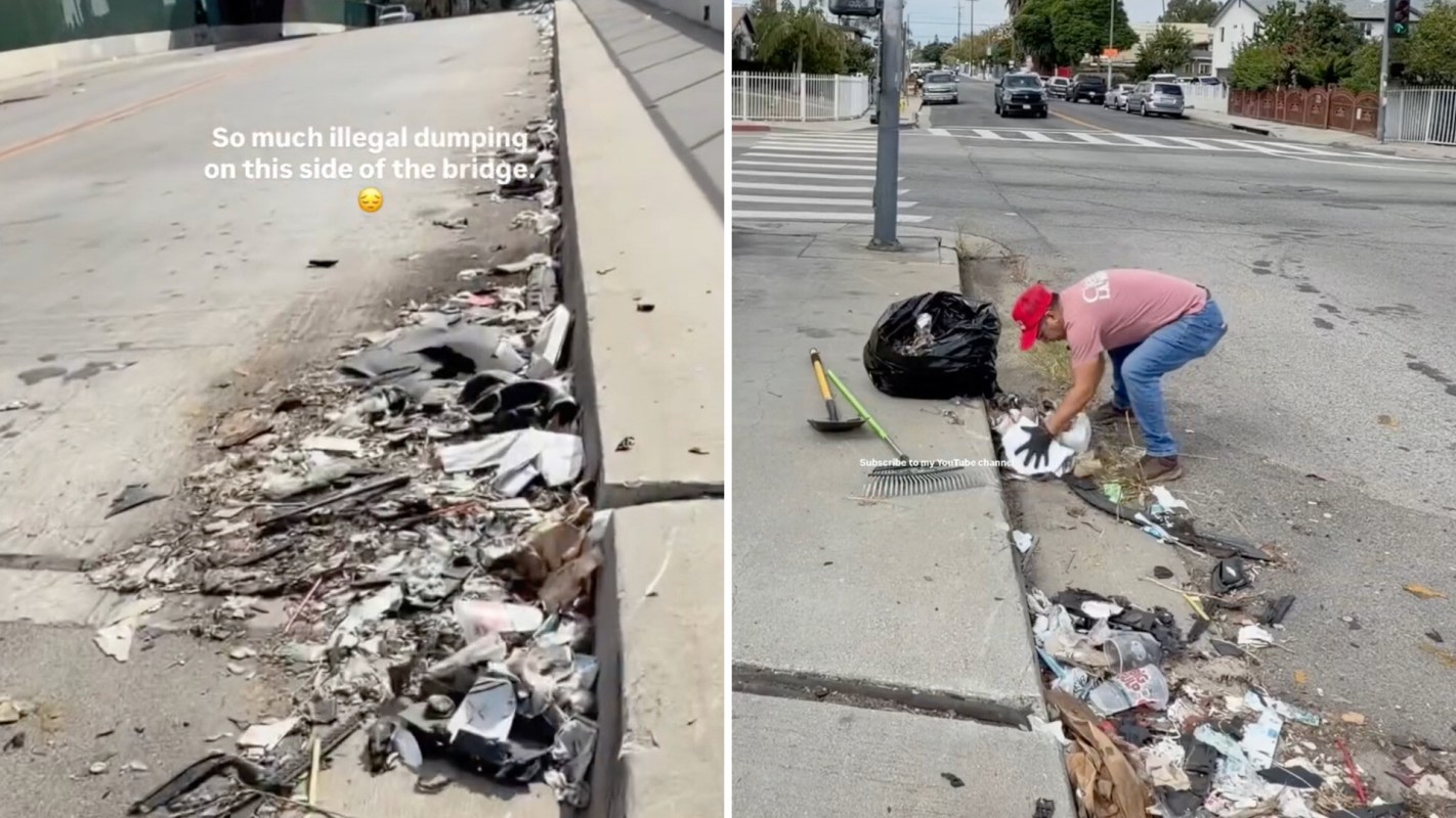 A man cleans up litter along the side of a road near a bridge.
