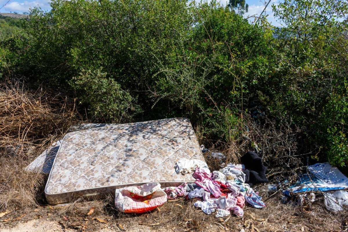Discarded mattress and clothes.
