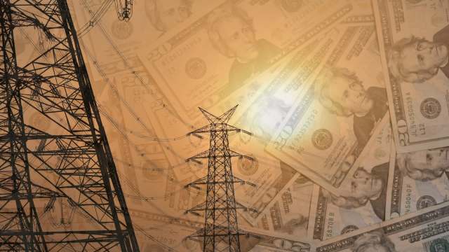 Power lines with money in the background.