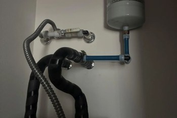 Piping on top of a water heater.