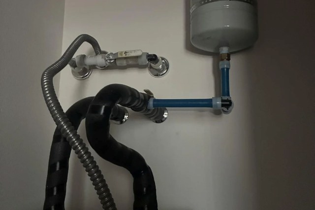 Piping on top of a water heater.