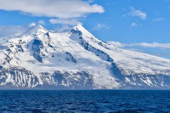 Jan Mayen's northwestern slope of Beerenberg Volcano and shoreline, featuring Weyprecht Glacier.