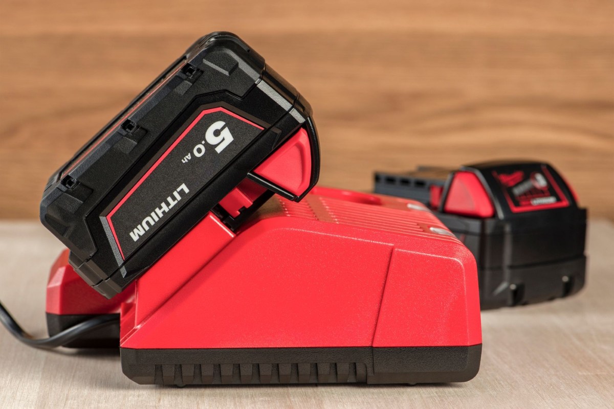 A lithium-ion battery for a power tool is plugged into a port to charge