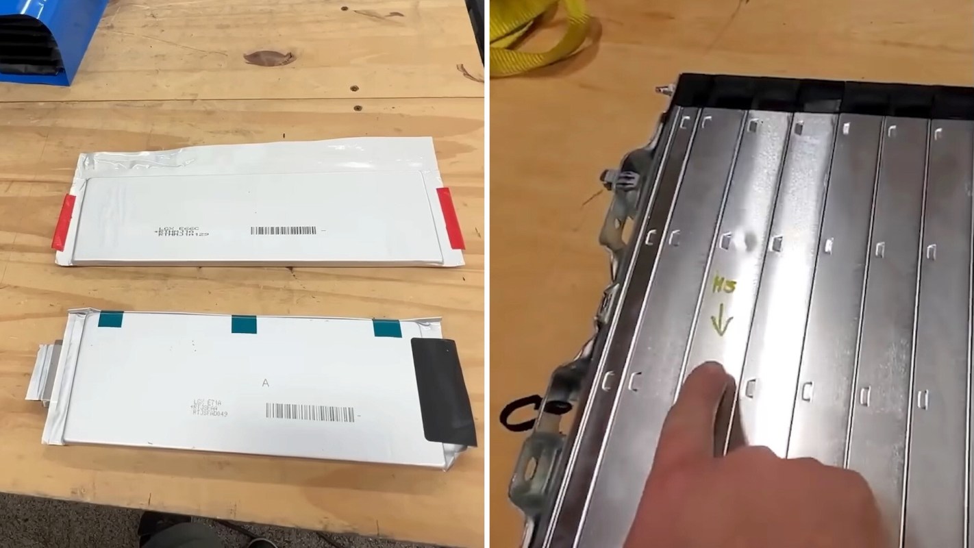 Two battery packs are laid out on a wooden surface next to a metallic component with labeled sections.