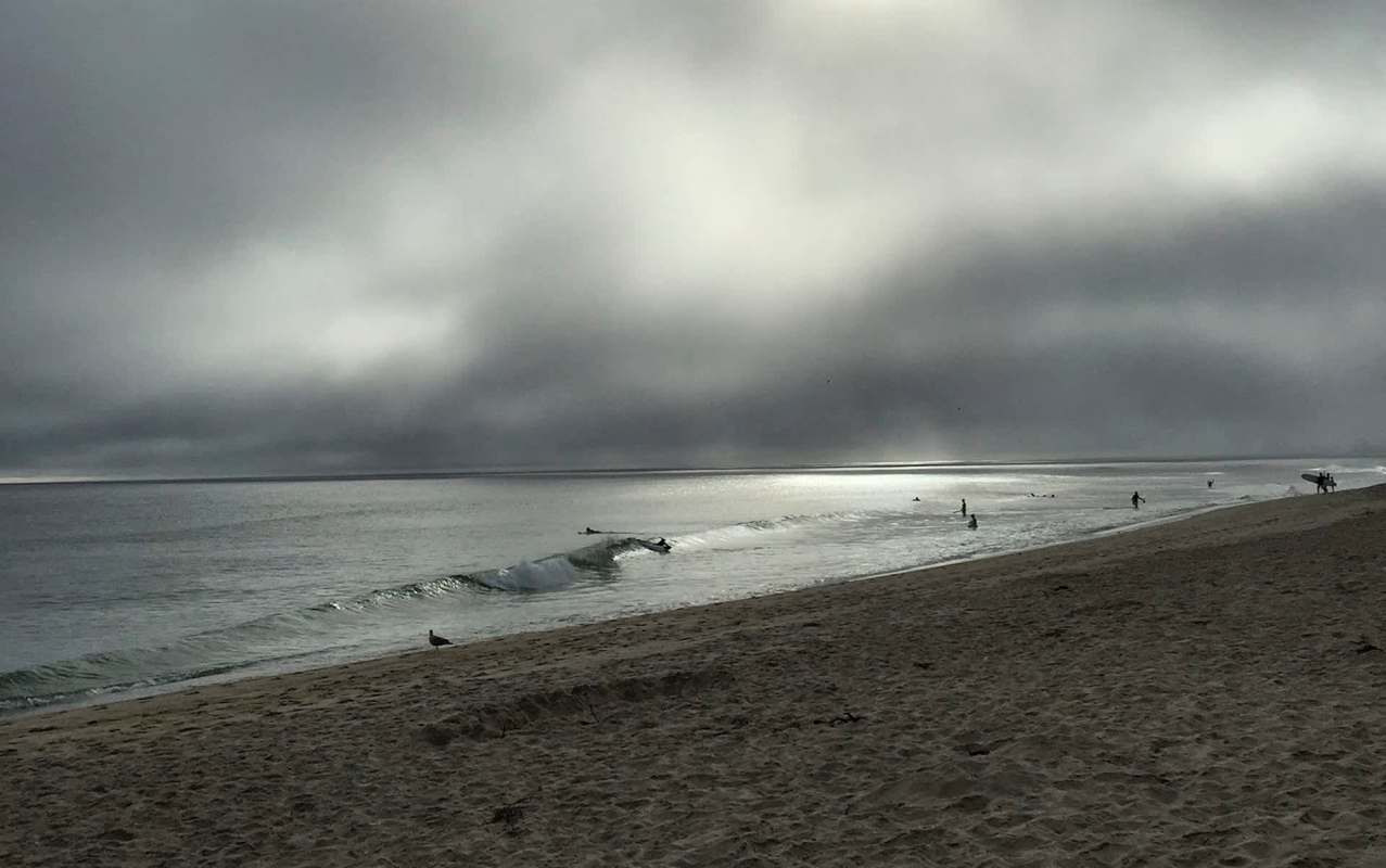 A beach on a dark, stormy day.