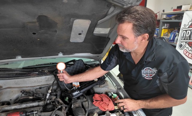 A mechanic working on a car.