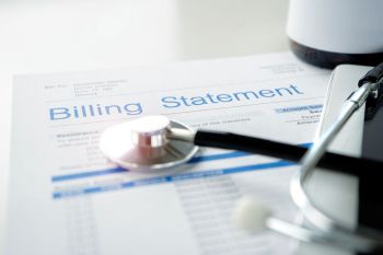 A billing statement for medical expenses with a stethoscope