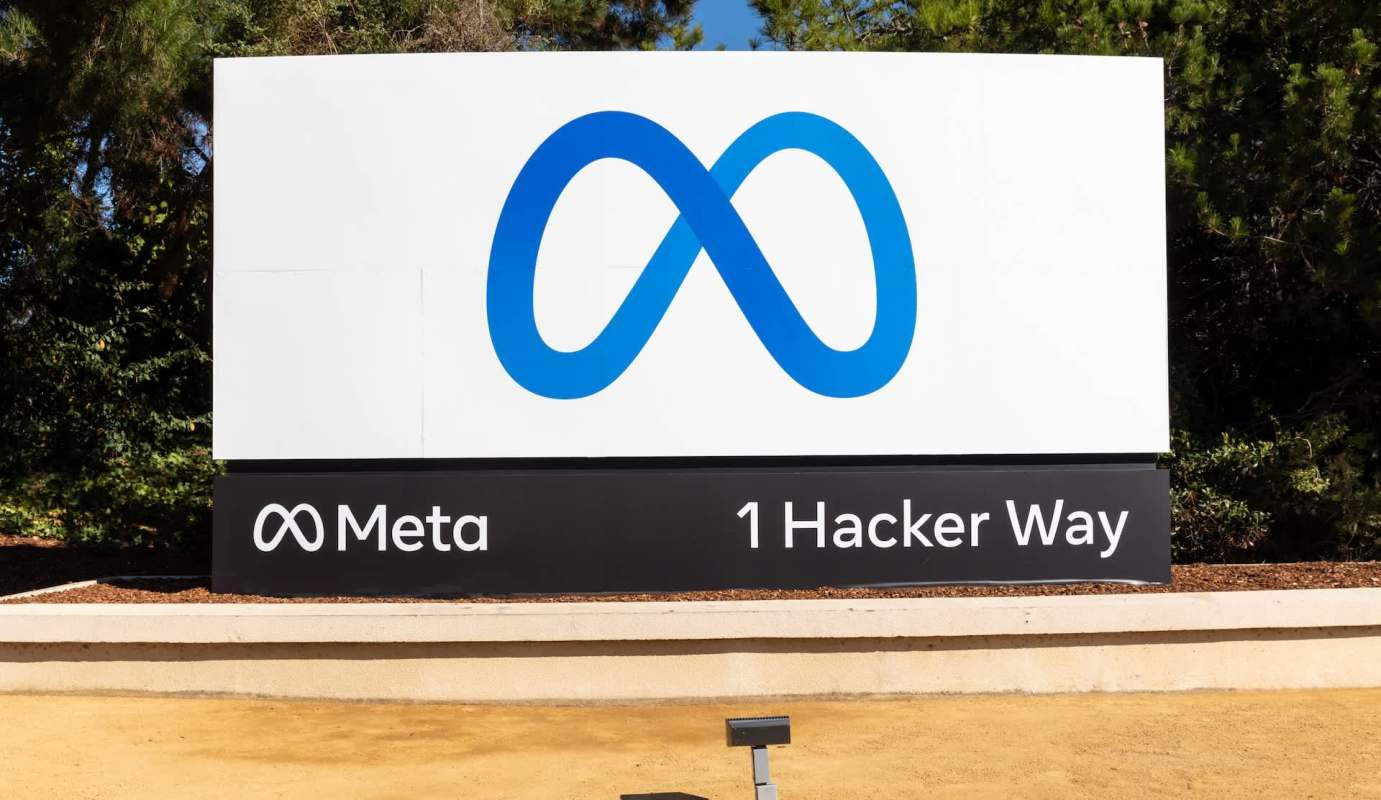 A sign displaying the Meta logo and the address "1 Hacker Way."