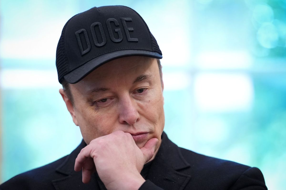Elon Musk wearing a DOGE hat.