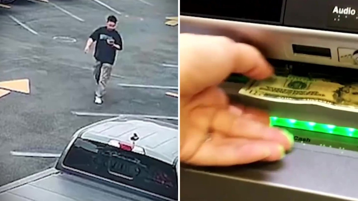A man walks in a parking lot while another hand retrieves cash from an ATM.
