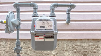 A natural gas meter outside of a home.