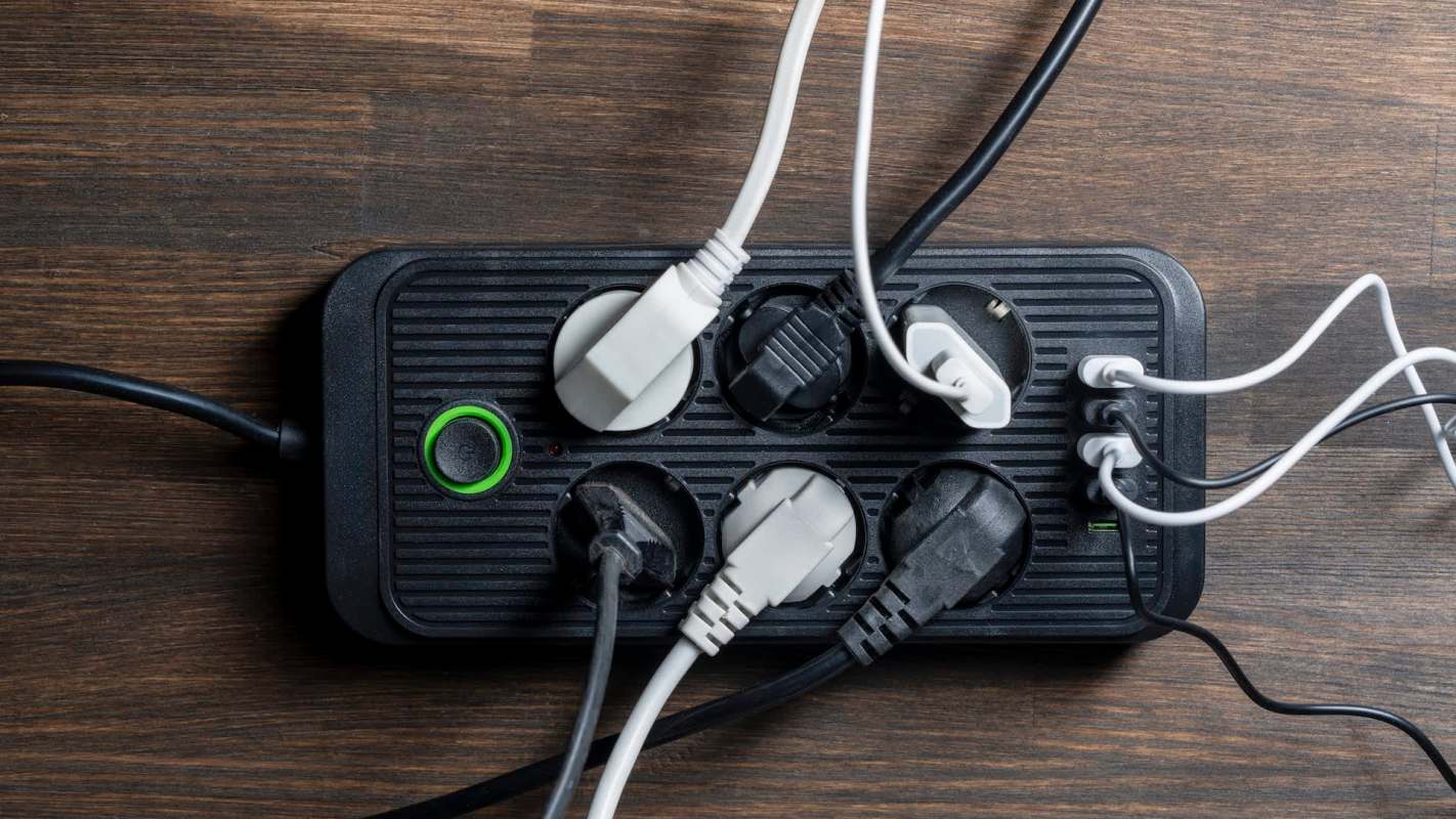 Cables plugged into a power strip.