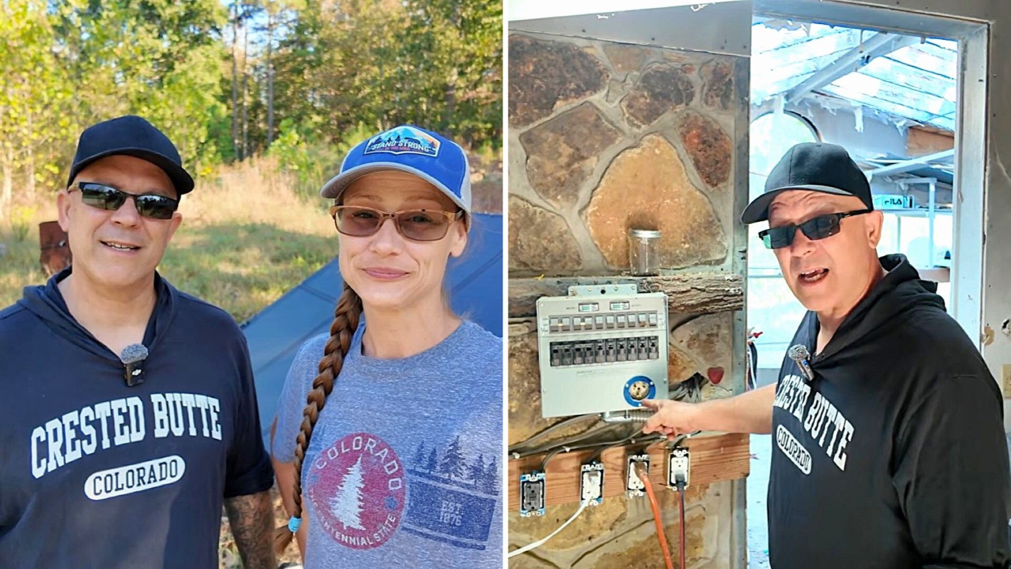 Two people standing outdoors near a solar panel, and an electrical panel inside a building.