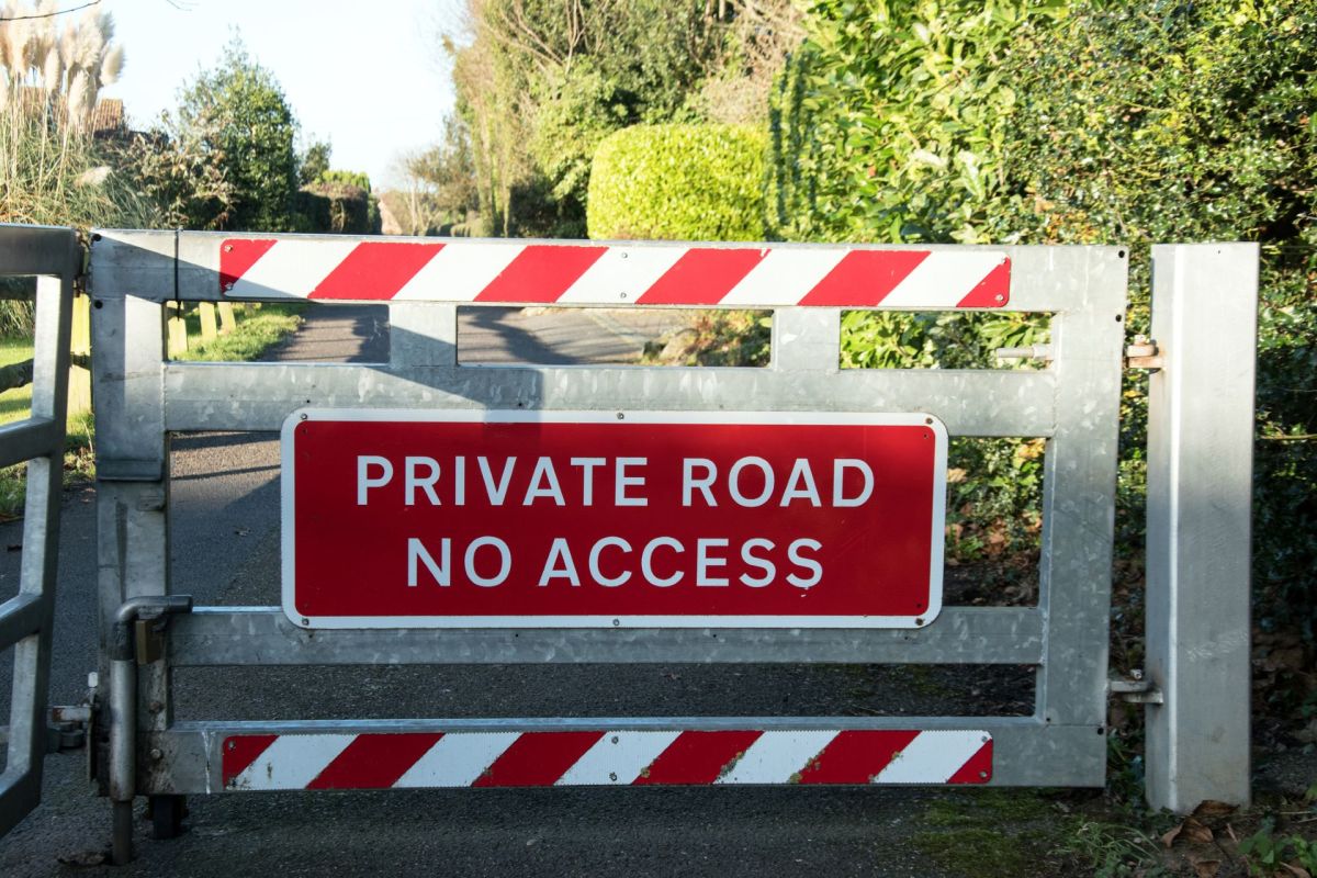 A gate in front of a private road.