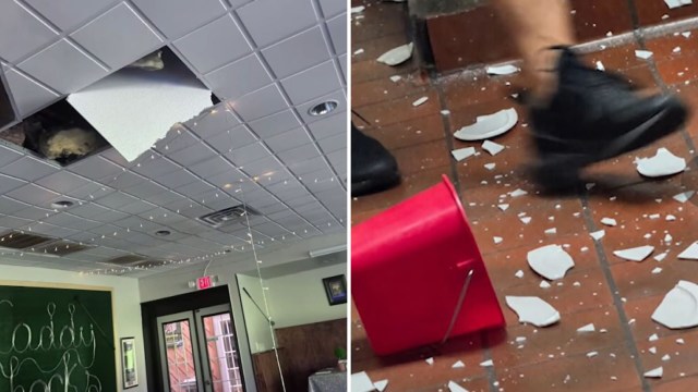Damage to a ceiling with a large hole and debris scattered on the floor, including broken plates and a red bucket.