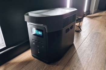 A portable power station with multiple outlets and an LED display.