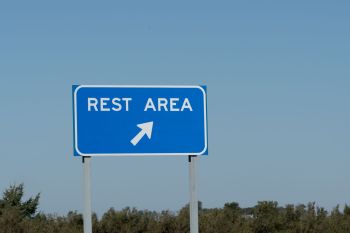 A highway rest area sign.