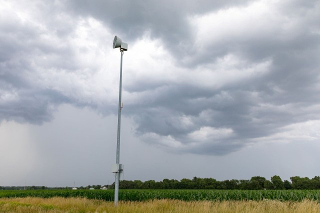 A siren on a pole.