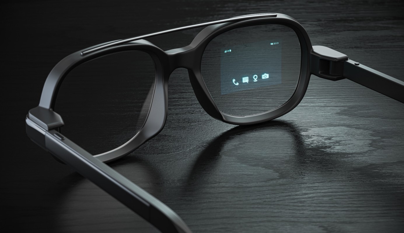 A pair of smart glasses displaying digital icons on the lenses, resting on a dark wooden surface.