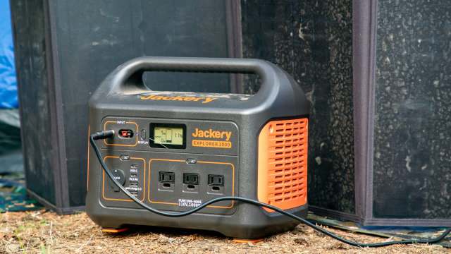 A portable power station with display and multiple output ports.