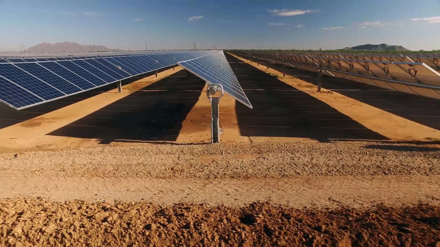 Rows of solar panels in a field.