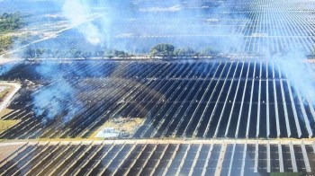 A grass fire in a solar farm.