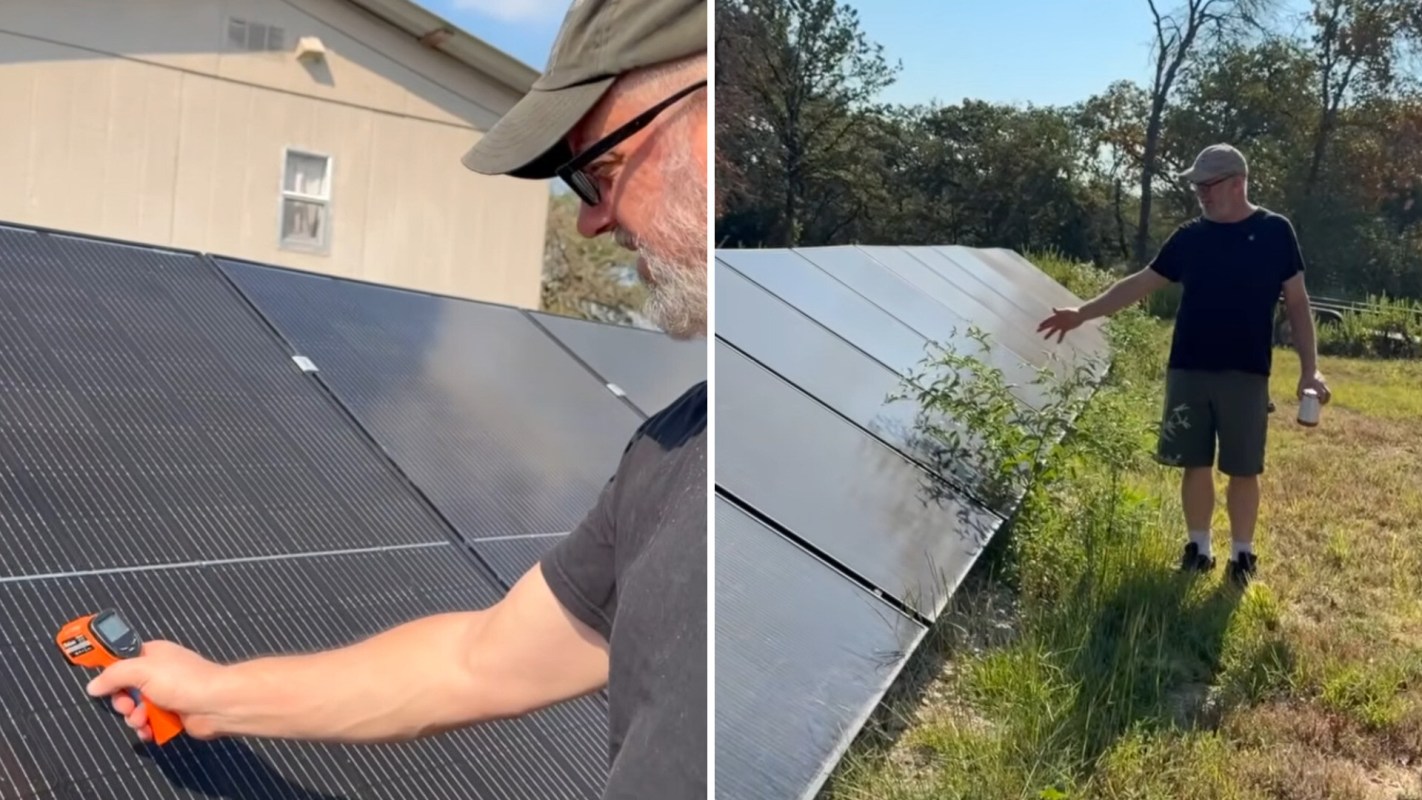 A person measures a solar panel with a digital thermometer while another person gestures near a solar array in a field.