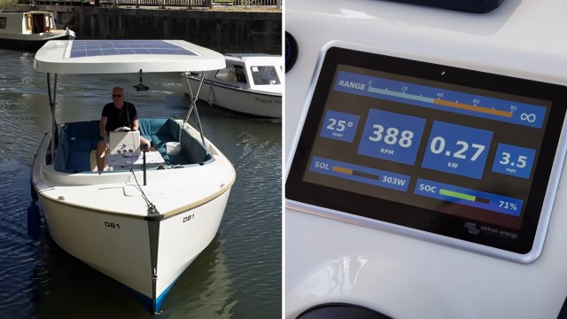 A person operates a boat with a solar panel and a digital display showing performance metrics.