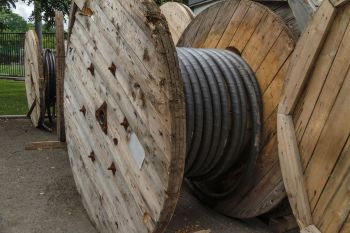 Wooden spools with industrial electric cable.