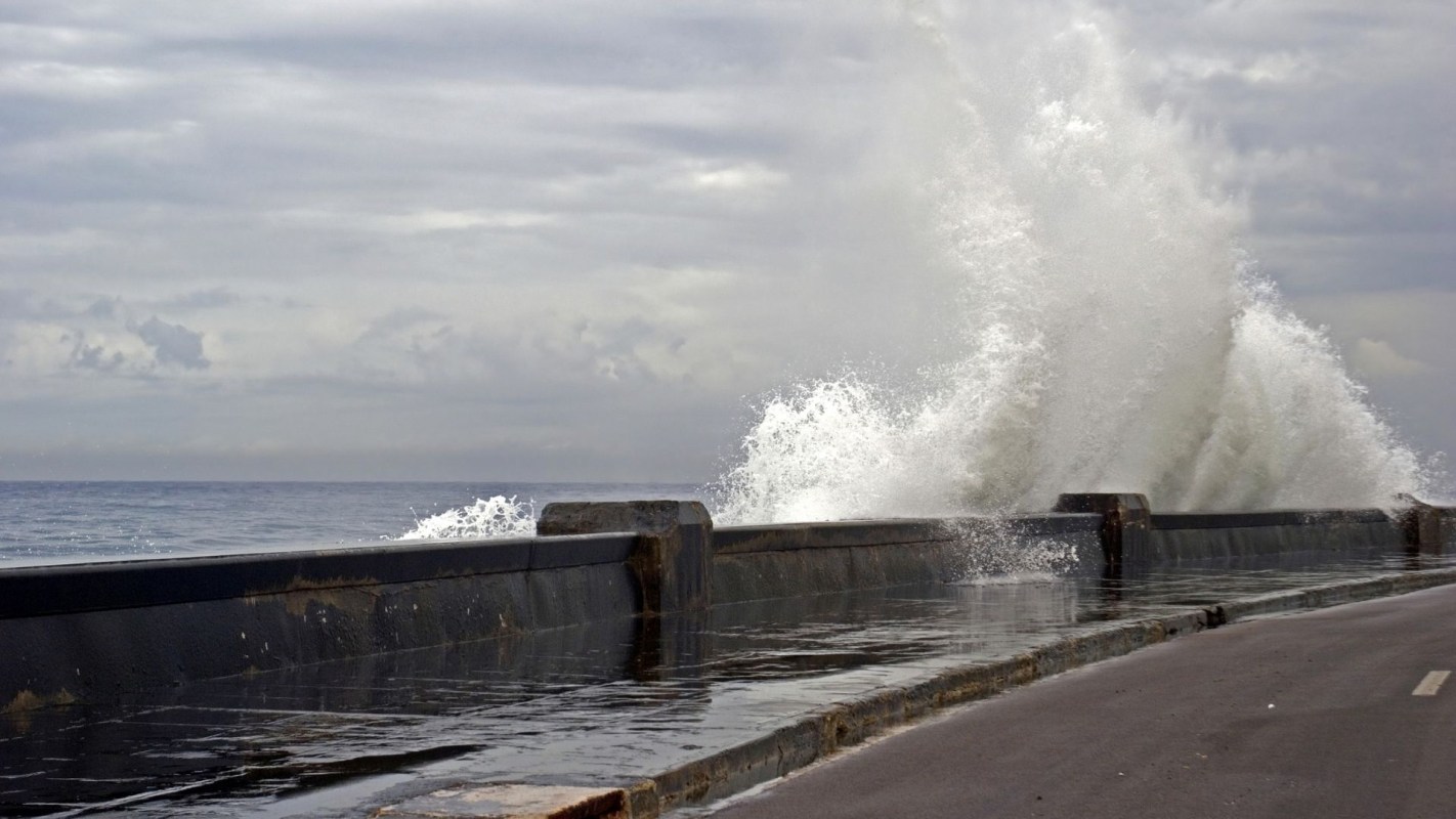 Waves crashing along a wall.