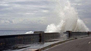 Waves crashing along a wall.