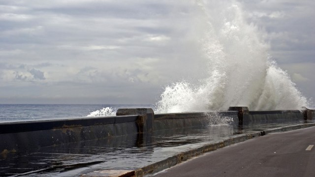 Waves crashing along a wall.