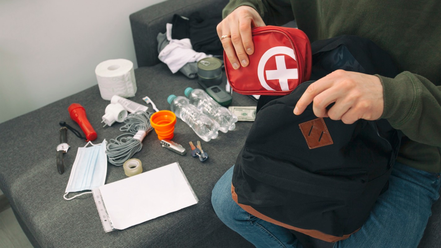 A person organizes emergency supplies.